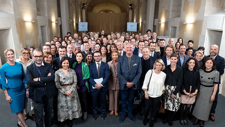Pictured: Representatives from the Fashion Pact's 56 member businesses and French President Emmanuel Macron meet in Paris. Image: Kering